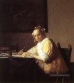 Une dame écrivant une lettre baroque Johannes Vermeer